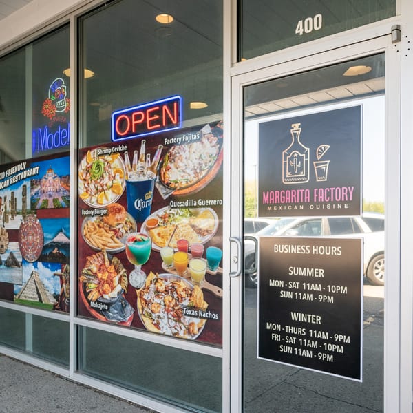 Exterior of Margarita Factory Mexican Cuisine, with menu images, business hours, and an "OPEN" sign.